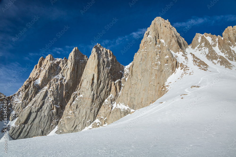 Morning light on the mountaineer's route up to Mount Whitney summit. Backcountry skiing the Eastern Sierra in winter.