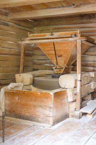 Interior of a traditional water mill producing flour