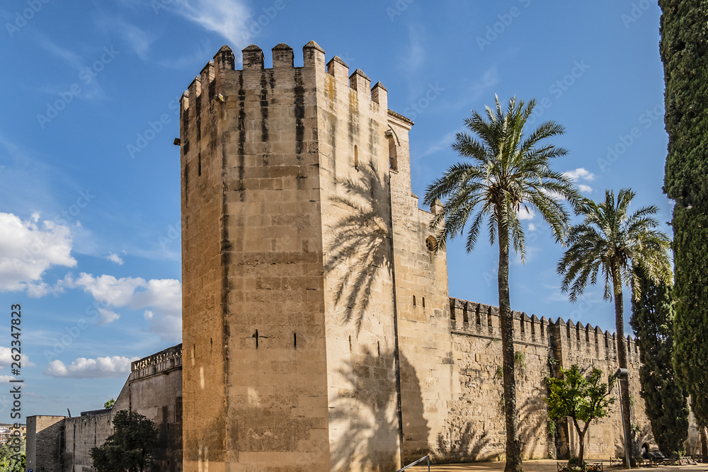 Architectural fragments of Wall and tower of Alcazar of Cordoba in Spain. Alcazar de los Reyes Cristianos (Castle of Christian Monarchs) - medieval castle located in historic center of Cordoba. 