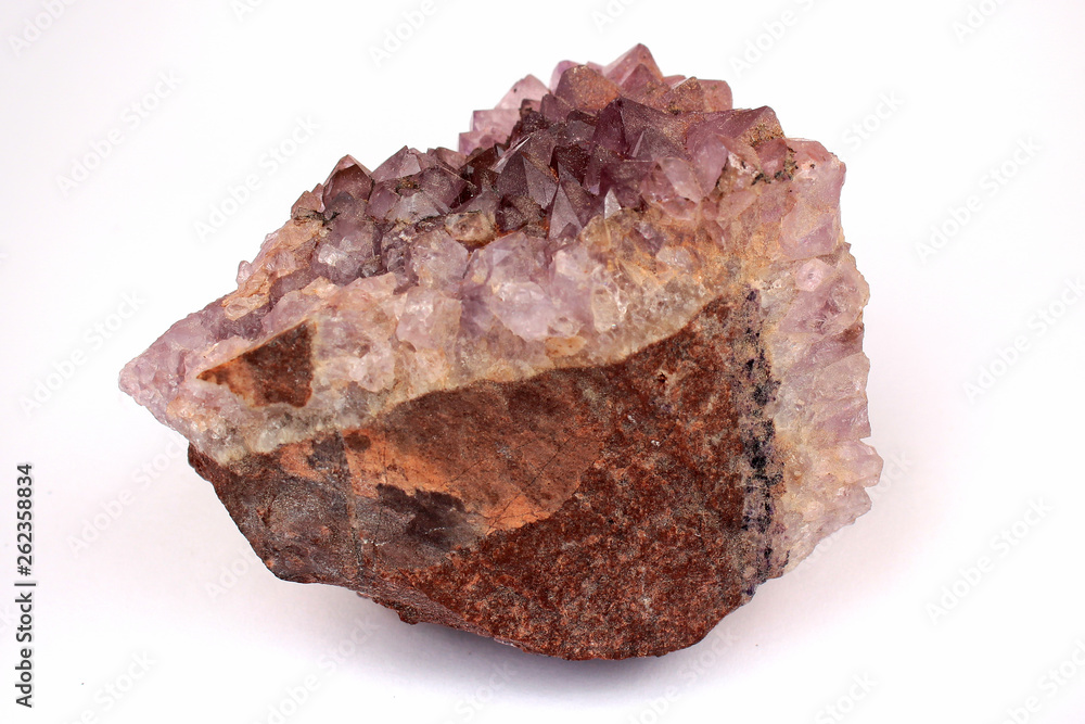Pink amethyst crystals on white background