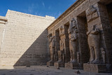 Luxor, Egypt: Corner of the peristyle courtyard at Medinet Habu, New Kingdom mortuary temple of Ramesses III on the West Bank of the Nile River.