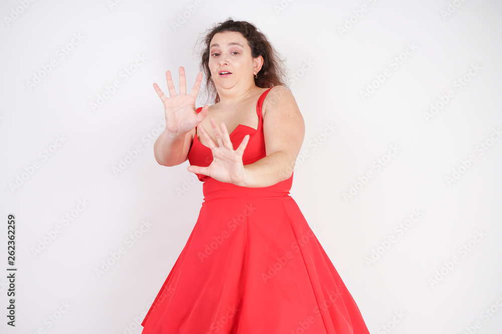 the violation of the rights of women and the attempt of aggression. a woman defends herself with her hands from the attacker and violence. the violation of the rights of women and the attempt of aggression. a woman defends herself with her hands from the attacker and violence.