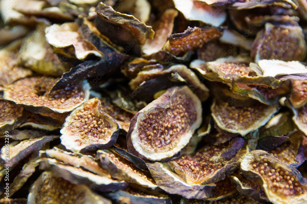 A pile of slices of dried figs fruit, close up. Tasty healthy snack. A pile of slices of dried figs fruit, close up. Tasty healthy snack.