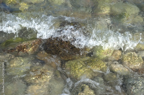 Large sea stones in sea water close-up