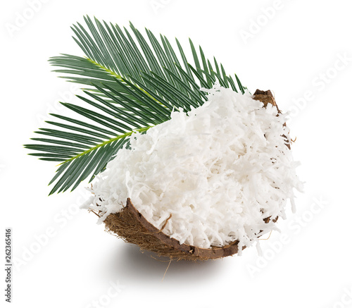 coconut with coconut flakes and palm leaves isolated on the white background