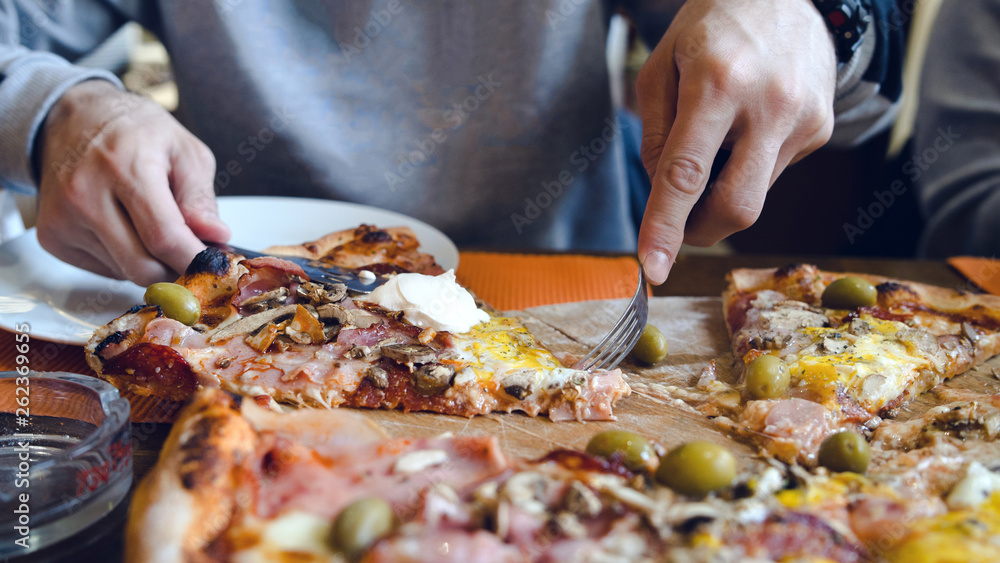 Close up on the slice Pizza On the table at the restaurant