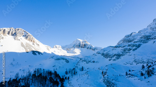 Wallpaper Mural Winter landscape with the mountain peaks covered by heavy snow. Aerial view by drone.  Torontodigital.ca