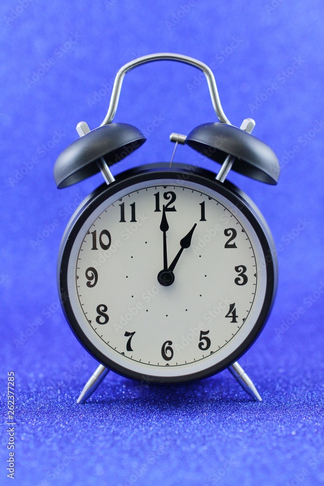 Alarm clock isolated on blue background Alarm clock isolated on blue background