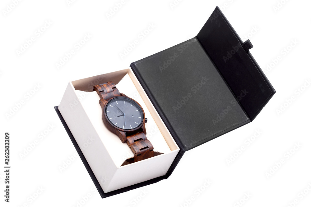 wooden wrist watch packed in open a cardboard box top side view, an accessory in a package on a white background. wooden wrist watch packed in open a cardboard box top side view, an accessory in a package on a white background.