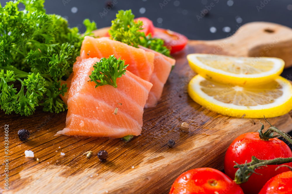 diet healthy food concept, raw fresh salmon fillet and ingredients on wooden background diet healthy food concept, raw fresh salmon fillet and ingredients on wooden background