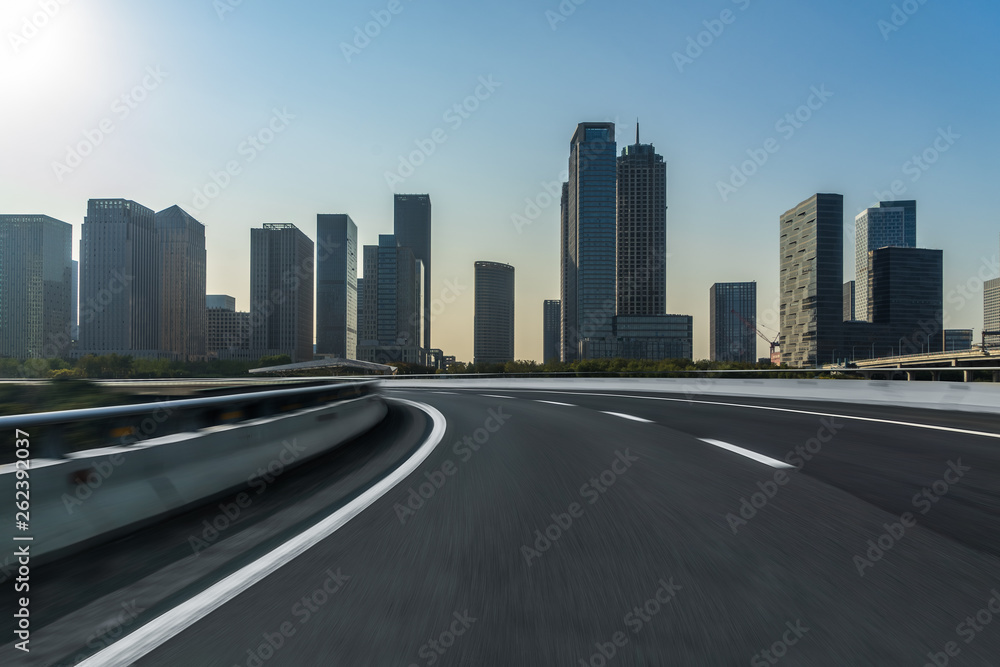 urban traffic road with cityscape in background, China. urban traffic road with cityscape in background, China.