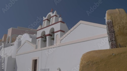 Ekklisia Isodia Theotokou bell tower in Oia, Santorini, Greece, Europe photo