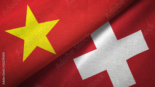 Schilderij op canvas Vietnam and Switzerland two flags textile cloth, fabric texture