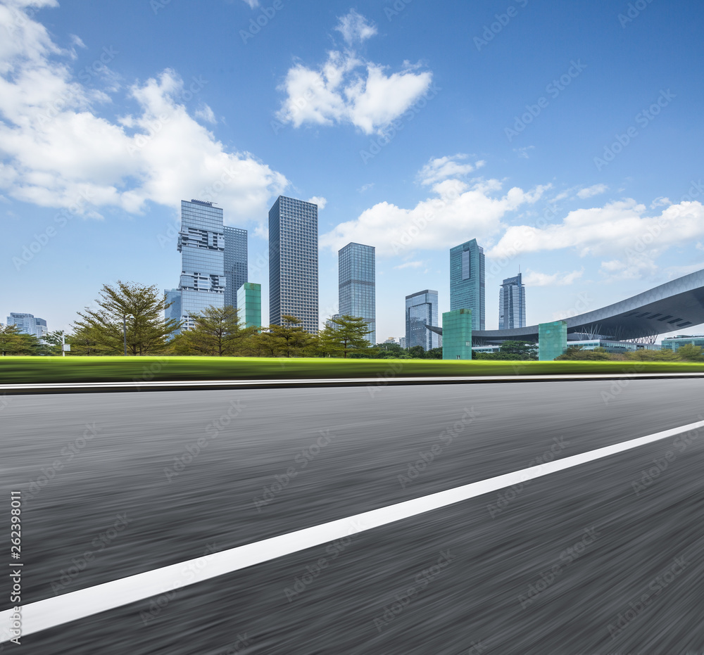 empty asphalt road with city skyline background in china. empty asphalt road with city skyline background in china.