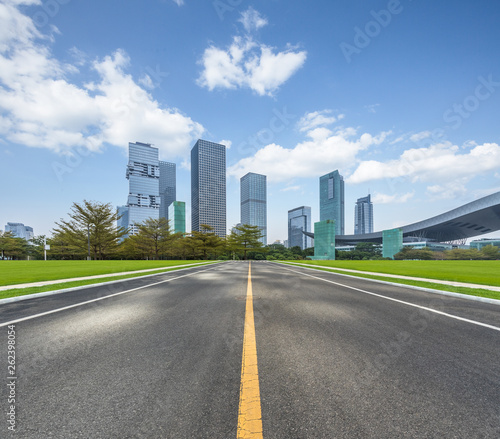 city road through modern buildings in Shenzhen.
