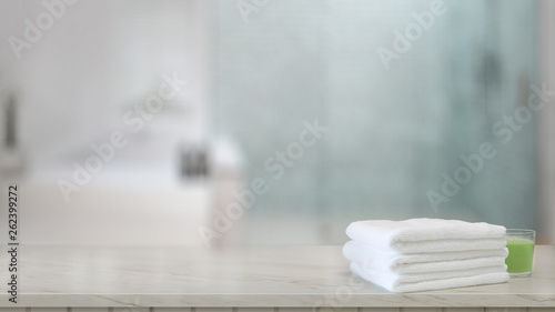 White towels on wood counter in modern bathroom