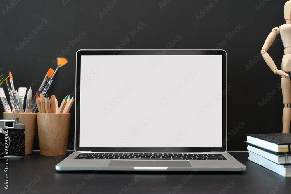 Mock up blank screen laptop on artist workspace Mock up blank screen laptop on artist workspace