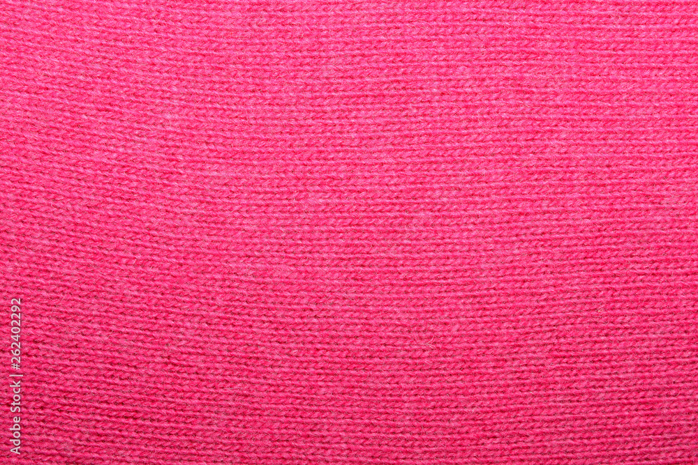 The texture of the knitted red fabric for the background The texture of the knitted red fabric for the background