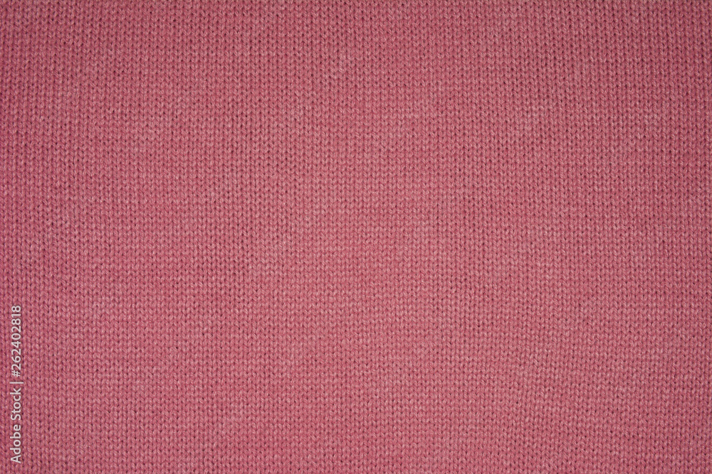 The texture of the knitted red fabric for the background The texture of the knitted red fabric for the background