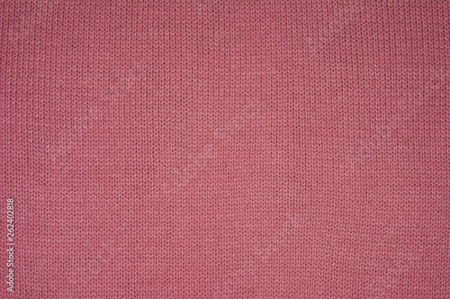 The texture of the knitted red fabric for the background 