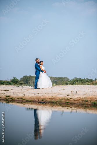 Asian bride and Caucasian groom have romance time and happy together