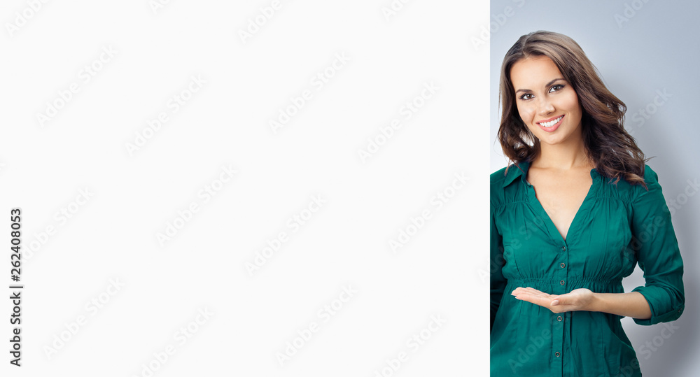 Beautiful young woman showing blank signboard Beautiful young woman showing blank signboard