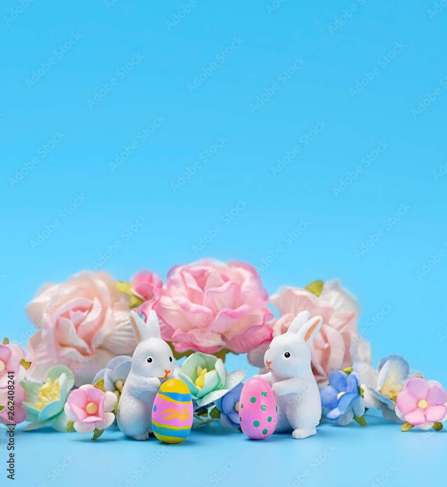 Happy Easter. two banny toy and eggs. Easter holiday background, spring season. Easter decoration with rabbits and eggs, Easter idea, minimalist stylish decor. Close up, copy space