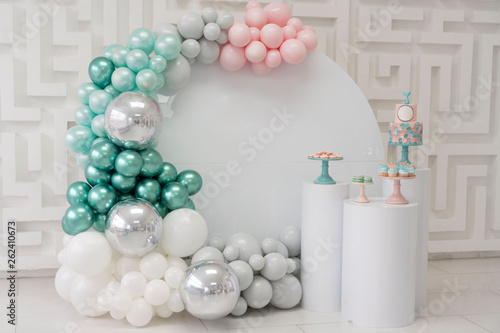 Birthday Part zone with pink silver  turquoise baloons and birthday cake photo