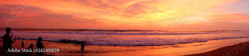 A panorama of the beautiful sunset at one of the beaches of Canggu, Bali, Indonesia