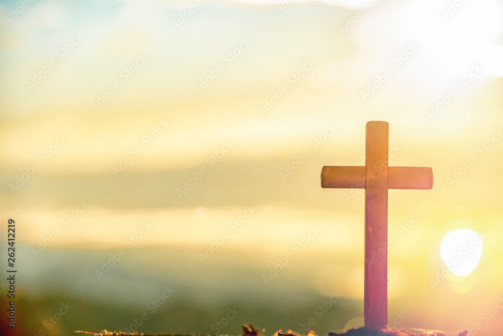 Wooden cross at sunrise in morning time with holy and light background .Crucifixion of jesus christ sign catholic religion concept