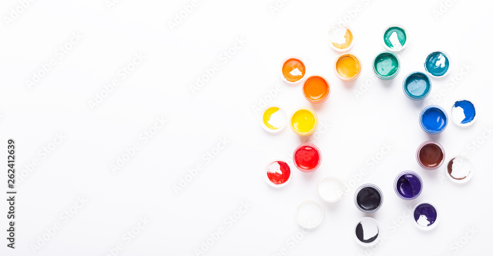 Multicolored gouache on a white background Circle shape Isolated Paints in containers Top view Banner Horizontal