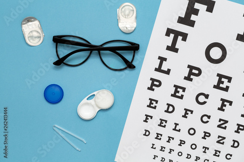 Contact lenses, glasses and accessories on color background. Vision concept. Flat lay composition.