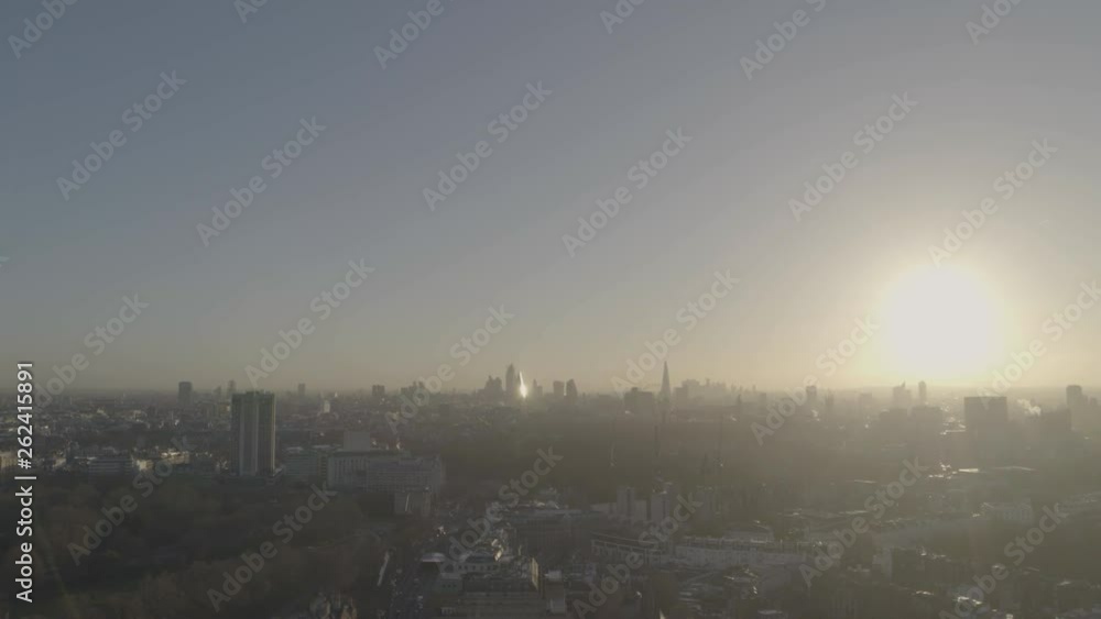 Sun shining brightly over the horizon over Knightsbridge London including Royal Albert Hall Sun shining brightly over the horizon over Knightsbridge London including Royal Albert Hall