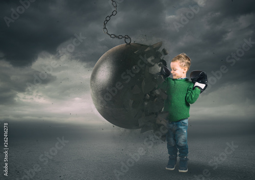 Принти на полотні Power and determination of a child against a wrecking ball