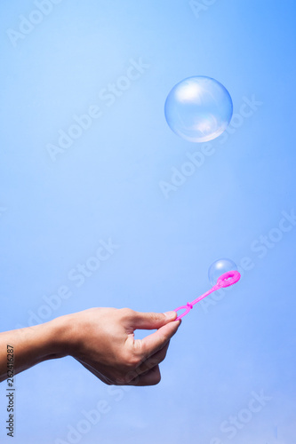 soap bubble in the blue background sphere color ball, round, circle © LAYHONG