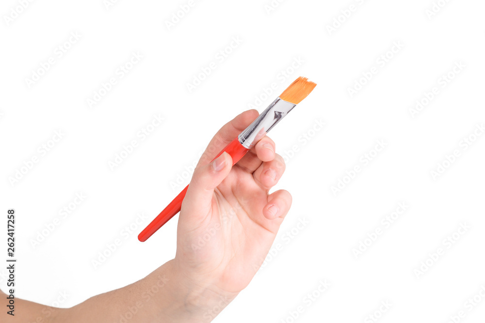 Hand holding a paint brush. Hand holding a paint brush.
