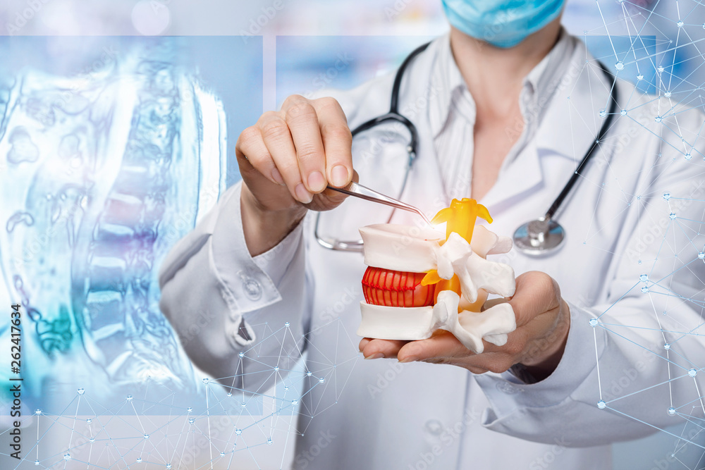 A doctor operating with herniated disc. A doctor operating with herniated disc.