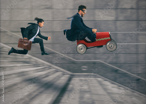 Reckless business man races with a car to win a competition against the competitors. Concept of success and competition photo