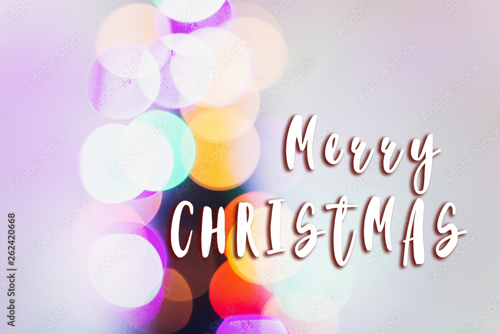 merry christmas text sign on colorful lights. bright bokeh. magical time. space for text. seasonal greetings concept.  winter holidays greeting concept