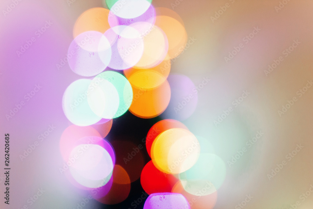 Fototapeta premium colorful christmas lights. bright bokeh. magical time. space for text. seasonal greetings concept. winter holidays