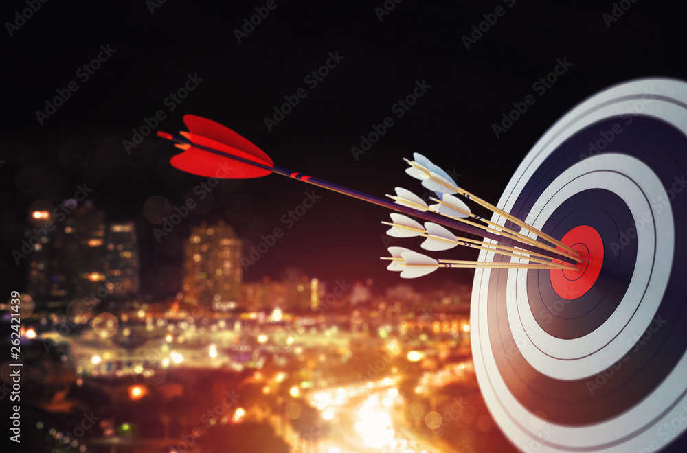 Arrow hit the center of target with modern skyline background. Business target achievement concept. 3D Rendering Arrow hit the center of target with modern skyline background. Business target achievement concept. 3D Rendering