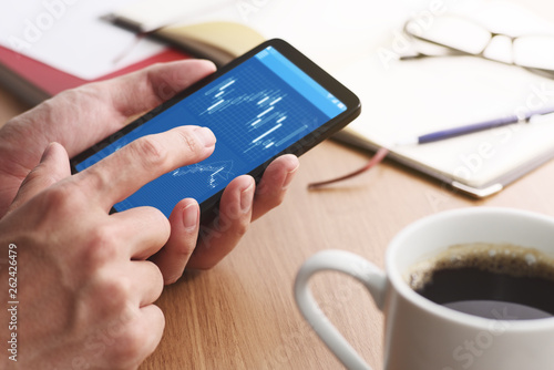 Cuadro en lienzo Stock market charts on smartphone screen