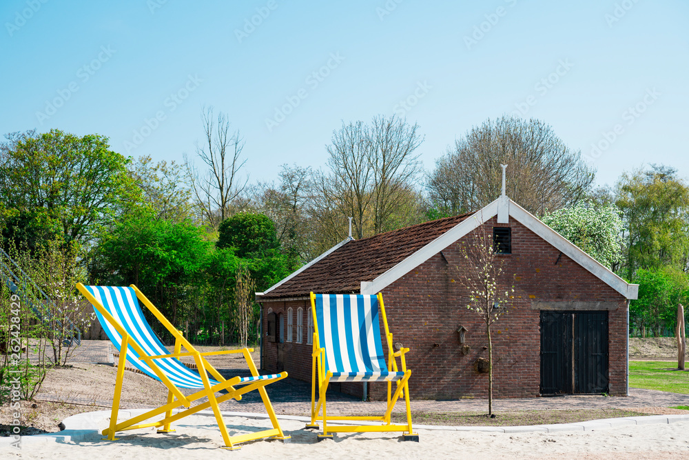 giant sun chairs on sand in Renesse. The Netherlands giant sun chairs on sand in Renesse. The Netherlands
