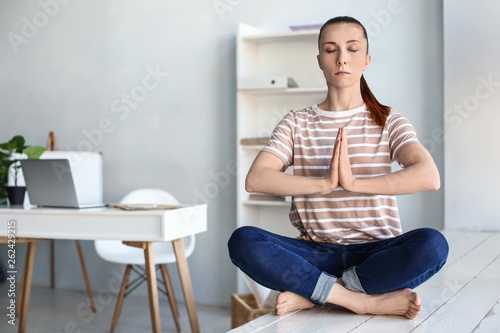 Woman practicing yoga indoors Free Download Woman practicing yoga indoors - GFXLoad