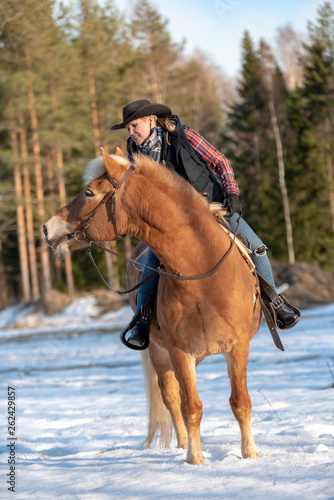 Woman horseback riding  © citikka