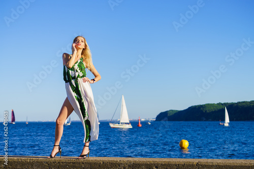 Fashion woman against yachts on sea