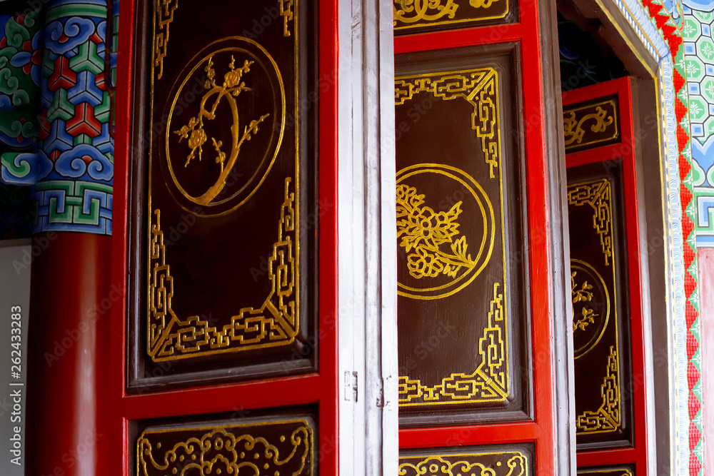 Decorated doors in a temple in the Chinese gardens of the Black Dragon Pool in Jade Spring Park, Lijiang, Yunnan, China