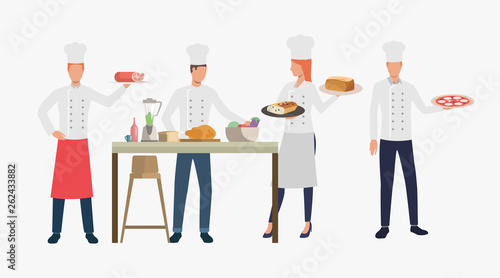 Cooks cooking dishes in restaurant kitchen