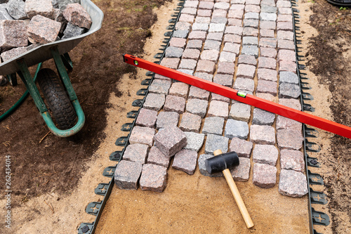 landscaping and garden services - granite cobblestone walkway construction photo
