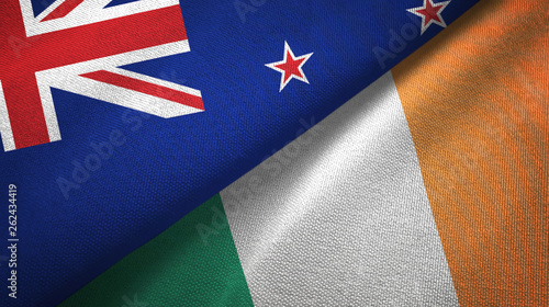 New Zealand and Ireland two flags textile cloth, fabric texture photo